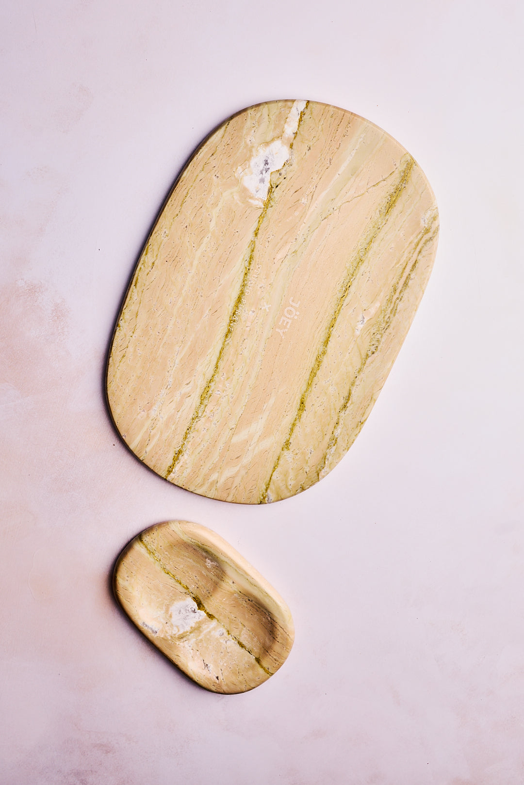 Jöey x Studio Purani handcrafted stone cheese platter on a grey background