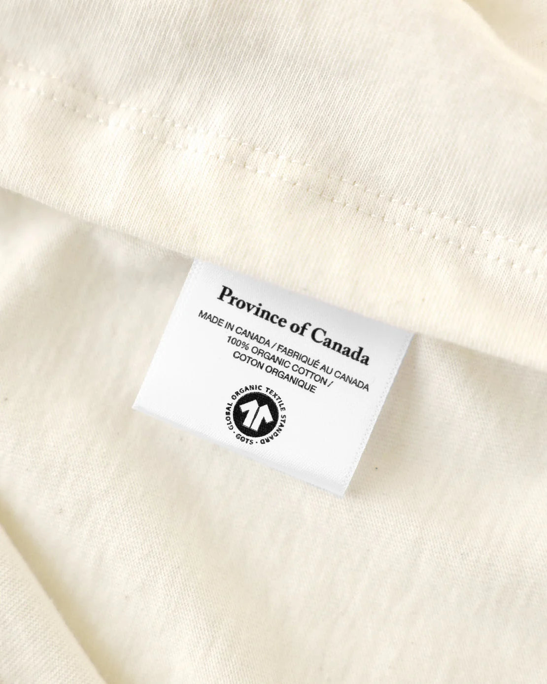 Jöey x Province of Canada Tee, close-up of the cotton tag detail